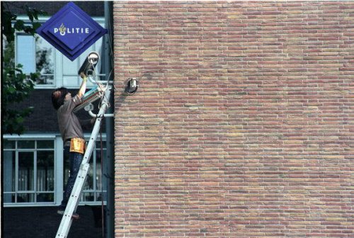 System Azure Security Ornamentation, Performances at Amsterdam Police Headquarters, rhinestone covered surveillance cameras ©&nbsp;Jill Magid (2002)